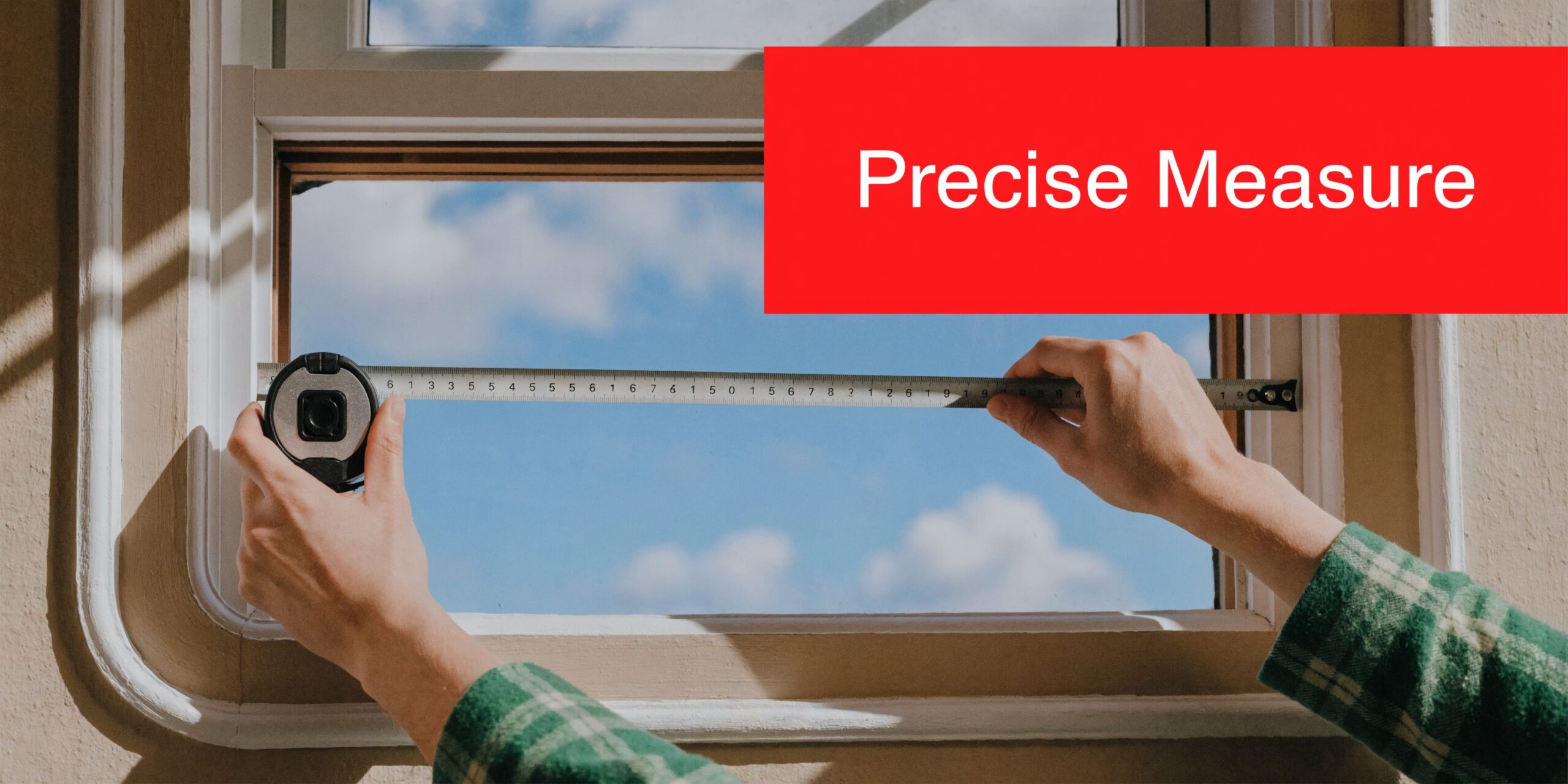 Insect Screens A person using a metal tape measure to accurately determine the width of a window frame.
