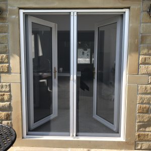 Double retractable insect screen doors