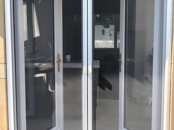 Double retractable insect screen doors