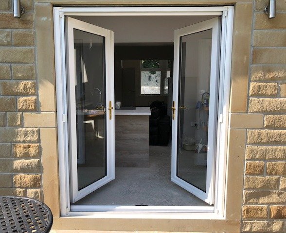 Double retractable insect screen doors